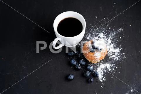 Blueberry antioxidant organic superfood and sweet muffin with cup of coffe Co Stock Photos