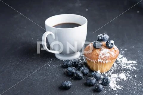 Blueberry antioxidant organic superfood and sweet muffin with cup of coffe Co Stock Photos