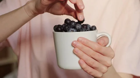 Blueberry berry background in woman's hands close up, Macro Water drops on ripe Stock Footage 250352016
