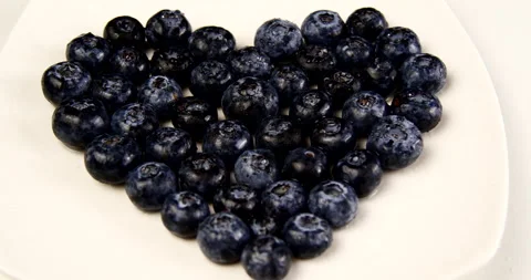 Blueberry berry heart-shaped composition on white background Stock Footage 143669476