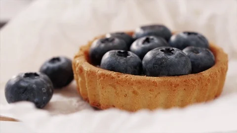 Blueberry Cake on paper circular camera move Stock Footage