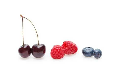 Blueberry, cherry and raspberry berries isolated on white background Stock Photos