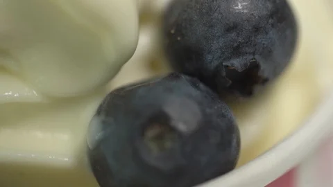 Blueberry closeup in yogurt Stock Footage 104350690
