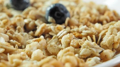 Blueberry falling down to flakes, slow motion Stock Footage 122373644