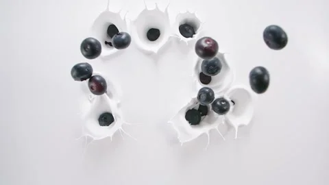Blueberry falling down to the milk Stock Footage 171887614