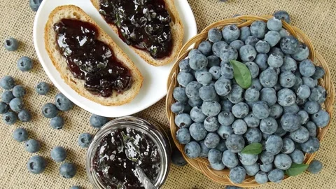 Blueberry jam on the table. Stock Footage 297250228