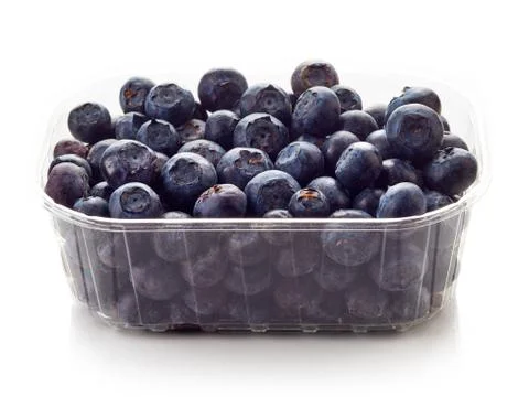 Blueberry in plastic container box isolated on white Stock Photos