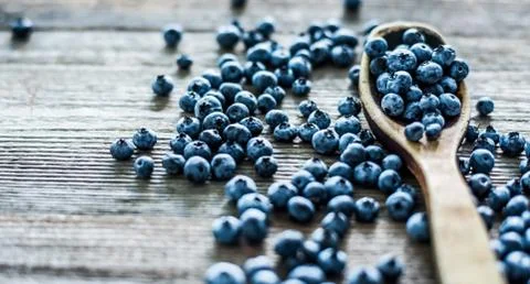 Blueberry with spoon on the table Stock Photos