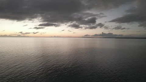 Bluefields Bay Drone Aerial with Dramatic Clouds- Evening, Westmoreland, Jamaica Stock Footage 300294849
