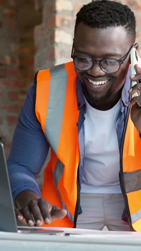 Blueprint, architecture and black man with phone call, laptop and update for Stock Footage 337535383
