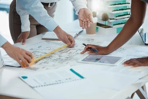 Blueprint, construction and architect team planning in meeting, drawing on paper Stock Photos