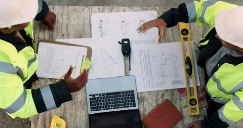 Blueprint, laptop and construction managers with handshake on site for Stock Footage 336203414