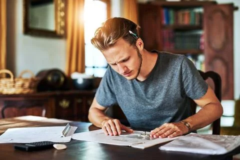 Blueprint, problem and architect planning a project in home office confused with Stock Photos