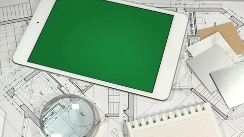 Blueprints, an electronic tablet with a green screen, notebook and samples Stock Footage 94128296