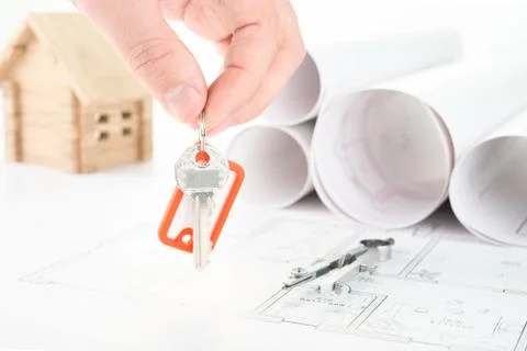Blueprints hand with keys Stock Photos