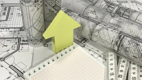 Blueprints - rolls of architectural drawings, notebook, yardstick Stock Footage 94823740