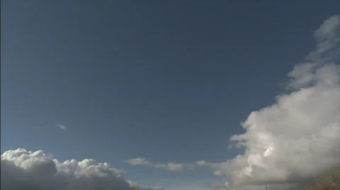 BlueSkyWithStormCloudsEdging Stock Footage 441841