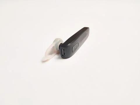 Bluetooth earphone on white background Stock Photos