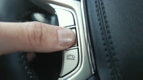 Bluetooth Hands Free Phone Control on a Car Steering Wheel Stock Footage 132600980