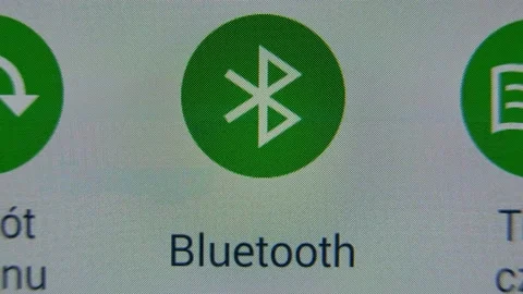 Bluetooth Icon Toggled On and Off on Mobile Device Touchscreen Stock Footage 141654342