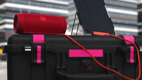 Bluetooth speaker connected to portable solar panel. Stock Footage 157590615