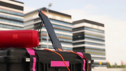Bluetooth speaker connected to portable solar panel. Stock Footage 157590814