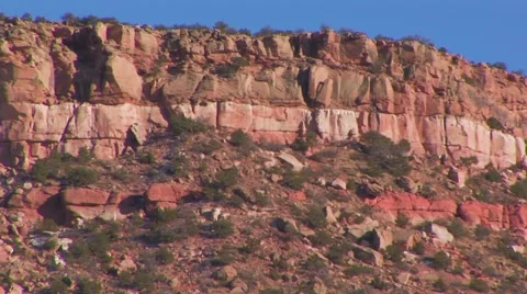 Bluffs with horizontal red rock striations Stock Footage 60693284