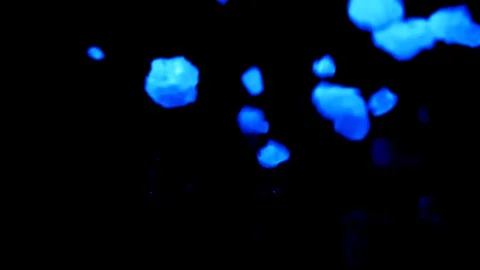 Bluish big pile crystal meth bath salt slow motion drop on reflective black Stock Footage 87238958