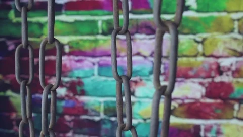 Bluish old chain on color background Stock Footage 79087124