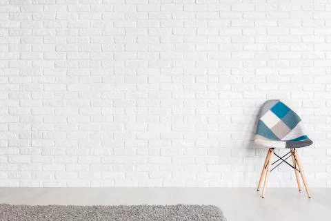 Bluish patchwork chair adding style to modern interior Stock Photos