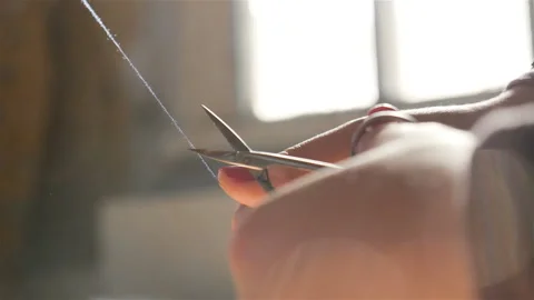 Blunt scissors. Women's hands. Close-up. Slow motion Stock Footage 90863503