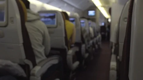 Blur background of airplane interior and passengers sitting Stock Footage 107091350