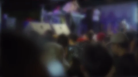 Blur background of colored lights from the stage at a live music festival at  Stock Footage 122585930