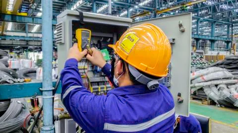 Blur background of electrical engineer are working on factory site, Technicia Stock Photos