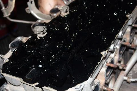 Blur at the background The interior of the engine and the black lubricant res Stock Photos