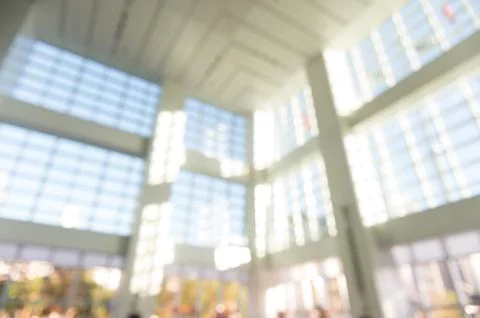 Blur background interior view looking out toward to empty office lobby and en Stock Photos