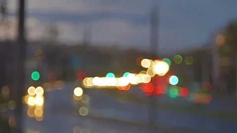Blur background. Moving bokeh circles of night traffic. Defocused night traffic Stockbeeldmateriaal 69164205