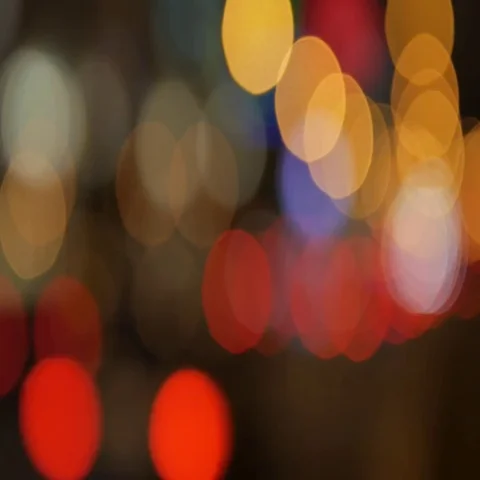 Blur background. Moving bokeh circles of night traffic. Defocused night traffic 動画素材 69379841