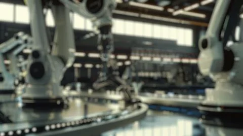Blur background of robot machine working together at production line. Spate. Stock Photos