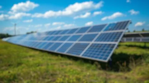 Blur background of solar station panel in the field. Electrical energy. Spate. Foto stock