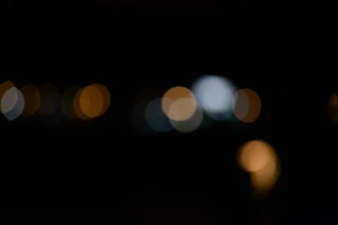 Blur bokeh. Blurry multicolor light from the lamp in the distance Stock Photos