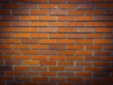 Blur brick wall background . Dark border Stock Photos