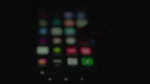 Blur close up hand using digital app phone  at night. Video stock 247493750