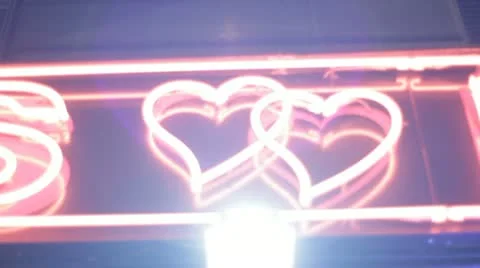 Blur, close up of neon hearts  - Moulin Rouge, stedi cam Stock Footage