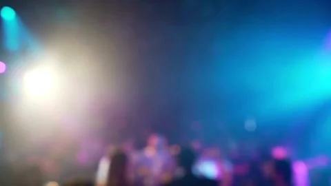 Blur crowd of people dancing on the dance floor of a night club light. blurry Stock Footage 265763396