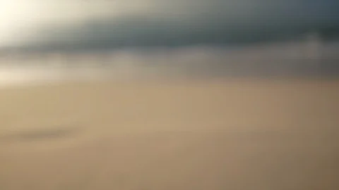 Blur defocus in beginning of  sea wave hit sand beach and focus in the end  , Video stock 99488154