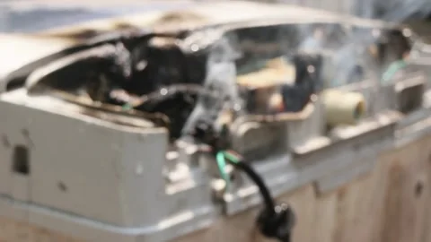 Blur defocus bokeh melted cable burned due to electrical short circuit Stock Footage 296782725