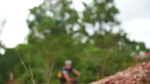 Blur defocus of cyclist ride mountain bike in forest for healthy and leisure  Vídeo Stock 131180025