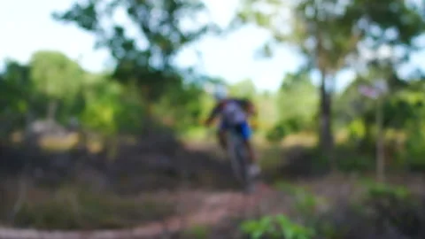 Blur defocus of cyclist ride mountain bike in forest for healthy and leisure  Stock Footage 131344255