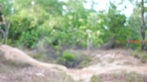 Blur defocus of cyclist ride mountain bike in forest for healthy and leisure  Stock Footage 131344452
